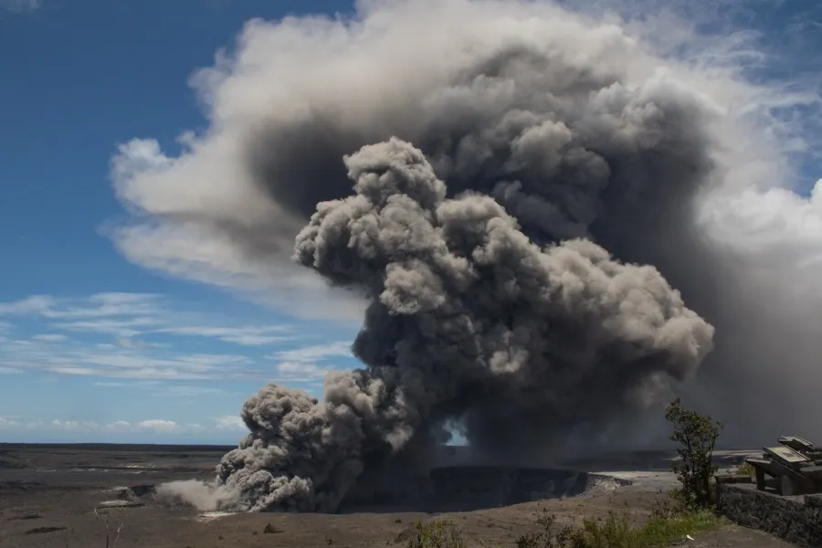 Dense grey and brown volcanic ash column with cauliflower-like lobes exploding from Halemaʻumaʻu crater