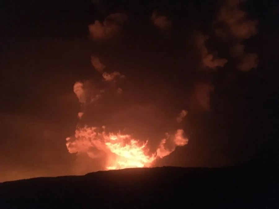 White translucent water vapor and volcanic gas plume rising passively from Halemaʻumaʻu crater rim